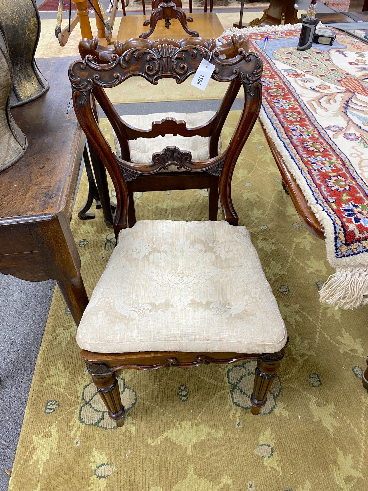 Gillows of Lancaster - a pair of Victorian carved rosewood dining chairs